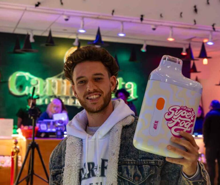 man holding a giant vape